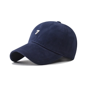 Detailed side view of navy cotton baseball cap with white number 7 embroidery