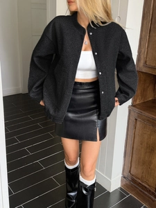 Women's casual solid black long sleeve vest jacket with leather mini skirt and boots