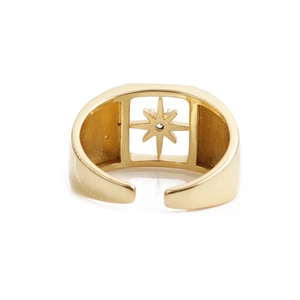 Golden North Star ring with sparkling crystal and adjustable band on white background