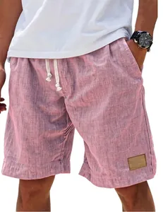 Detail of pink men's linen shorts showing elastic drawstring waist and fabric texture
