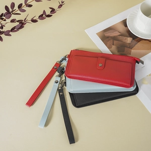 Minimalist long leather clutch wallet with wrist strap in red, grey, and black colors