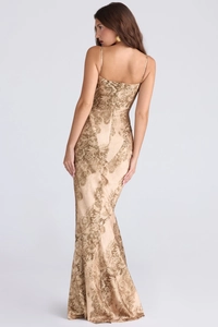 Detail of elegant gold floral evening dress featuring slim fit back zipper and silk texture