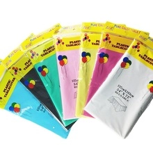 Detail of colorful reusable plastic tablecovers in white yellow pink and blue packaging