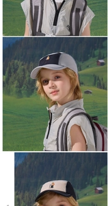 Dettaglio del cappellino parasole per bambini con ricamo montagna e design a tre colori