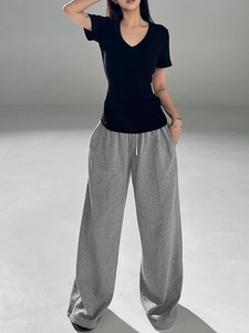 Slim fit black V-neck t-shirt styled with grey wide leg drawstring lounge pants