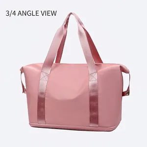 Detailed side view of light pink waterproof travel bag with double handles and bottom compartment