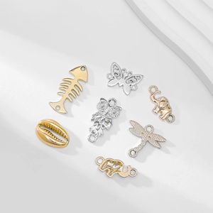 Set of vintage alloy charms in gold and silver fish bone butterfly and animal shapes