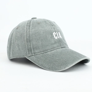 Close-up of CIA embroidery on dark gray washed cotton baseball cap with ventilation holes