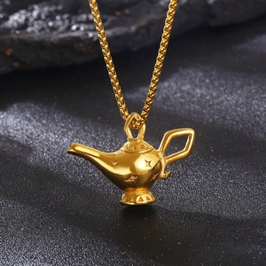 Detailed close-up of golden Aladdin magic lamp pendant on a box chain necklace
