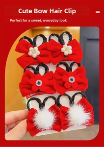 Detail view of 6-piece set red festive bow hair clips with synthetic wig braids for girls