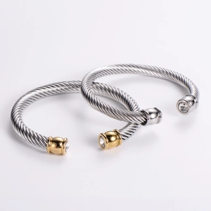 Modern twisted cable open bangles in silver and gold with sparkling zircon stones