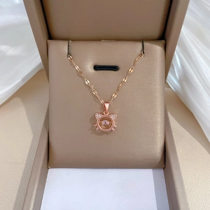 Elegant rose gold cat pendant necklace with sparkling stone in a jewelry box