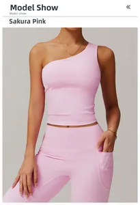 Detail of cherry blossom pink yoga set featuring one-shoulder tank top and side pockets