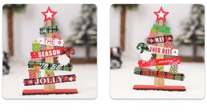 Detail of wooden Christmas tree ornaments with festive gnomes and Merry Christmas greetings