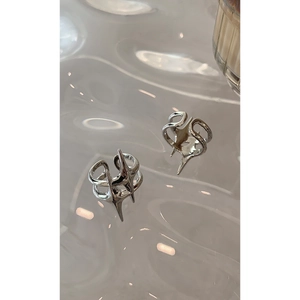 Minimalist silver starburst open ring with sharp star spikes and dual-ring structure
