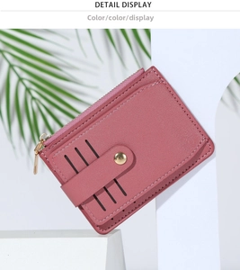 Detail display of pink PU leather card holder with zipper pocket and three card slots