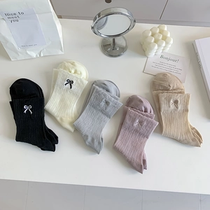Five pairs of ballet-style cotton socks with bow embroidery in soft pastel colors