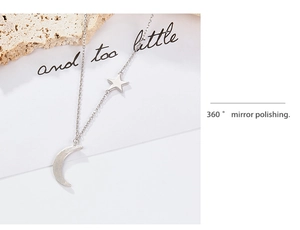 Detail showing 360-degree mirror polishing on silver star and moon pendant necklace