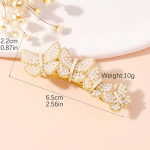 Golden butterfly hair clip with white pearls, size 6.5cm by 2.2cm and weight of 10g