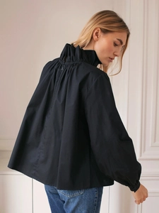 Women's black long sleeve shirt with a ruffled stand collar and gathered back detail