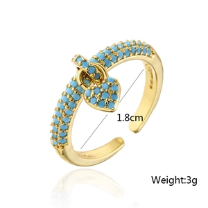 Detail of 1.8cm adjustable gold heart ring with turquoise stone inlay and weight specs