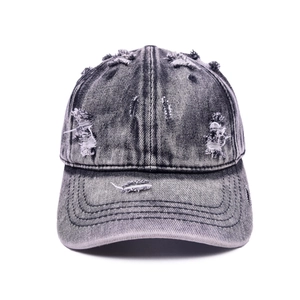 Distressed vintage washed denim baseball cap with ripped holes and retro stone-washed finish