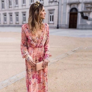Elegant pink floral maxi dress with deep V-neck and long sleeves for summer evenings