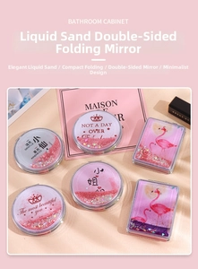 Detail of pink quicksand double-sided folding mirror with glitter and flamingo motif