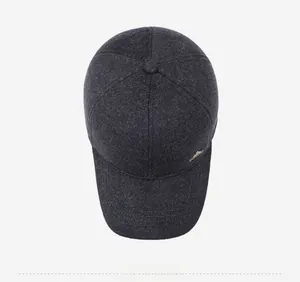 Top view of deep grey wool blend baseball cap showing texture and metal fish logo detail