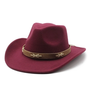 Detail of burgundy wool western hat with brown leather band and white cross stitching
