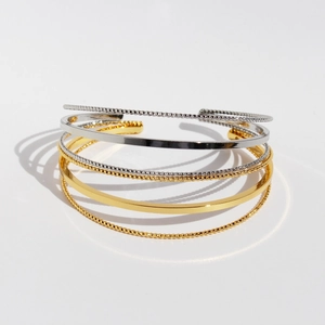 Minimalist geometric three-layer metal bracelets in gold and silver finish stack