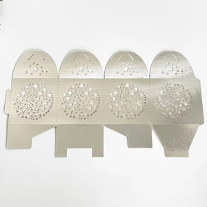 Detail of laser-cut star patterns on a metallic finish gift box template with high precision