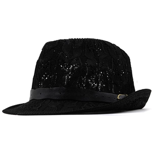 Close-up of black breathable straw fedora featuring a leather band and gold buckle detail