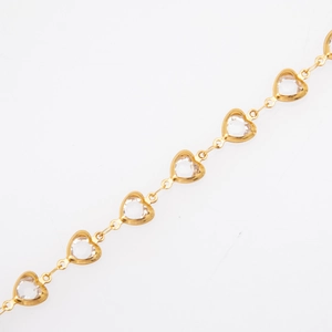 Close-up of gold-plated titanium heart charms with clear inlaid crystals on link chain