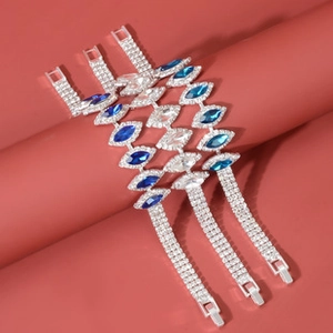 Detail of silver plated bracelets with sparkling blue and clear leaf shaped crystals