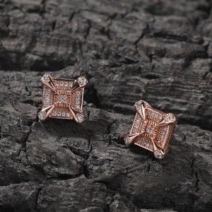 Hip hop style rose gold square zircon stud earrings with dragon claw design on dark charcoal