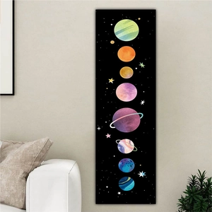 Vertical solar system wall scroll art hanging over a white sofa in a cozy living room