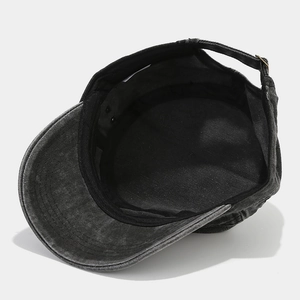 Detail view of washed denim army cap showing inner sweatband and metal adjustable buckle