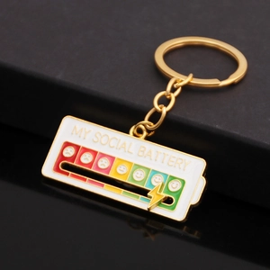 Macro detail of the interactive social battery slider charm with polished gold finish