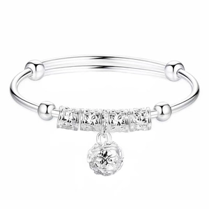 Silver-plated bangle with hollow bells and lucky beads on a clean white background