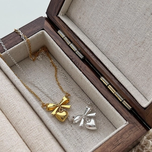Exquisite 925 sterling silver bow and heart necklace in gold and silver finishes
