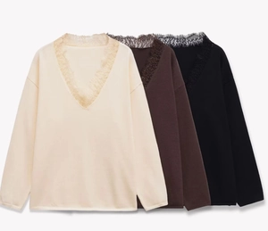 Detailed view of three wool blend knit tops in cream, brown and black with lace V-neckline