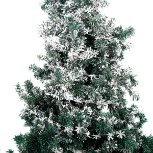 Close-up of white snowflake garland ornaments hanging on a green Christmas tree branch