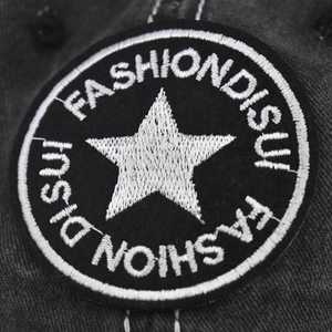 Washed cotton baseball cap featuring detailed star embroidery and vintage texture