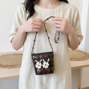 Handmade Bohemian coconut shell crossbody bag with floral beads and rustic woven details