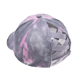 Close-up of pink and grey tie-dye ponytail baseball cap featuring criss-cross elastic bands