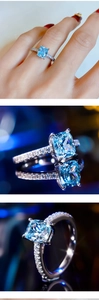 Macro view of blue square zircon ring with micro-paved diamonds on a silver band