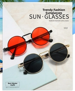 Detail of steampunk sunglasses with round metal frames and decorative spring hinge temples