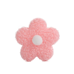 Pink plush teddy fleece five-petal flower accessory with white pompom center on white background