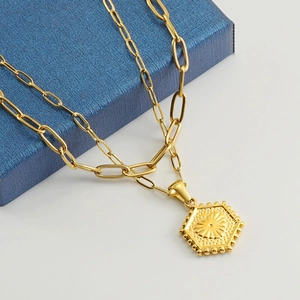 Double-layer 18K gold-plated stainless steel necklace with hexagonal pendant on blue box